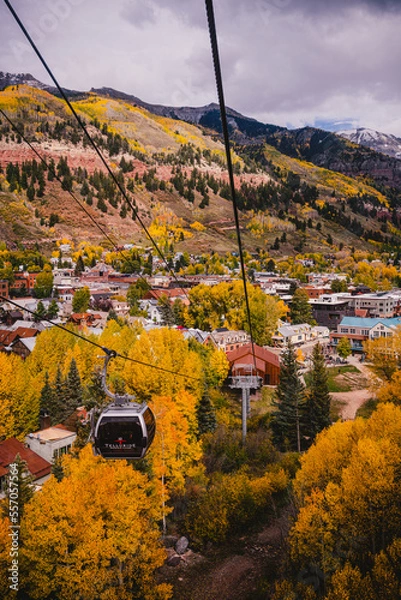 Fototapeta Landscape of sceneic views in Telluride, Colorado in the fall with colorful aspen trees, gondola, and purple mountain background