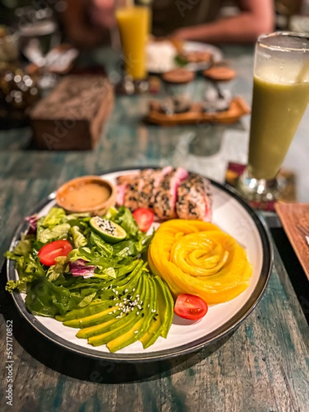Fototapeta Healthy breakfast wth avocado and mango 