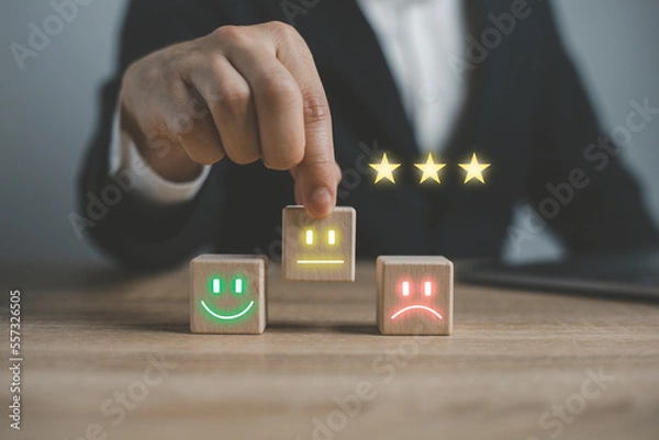 Obraz Survey, poll or questionnaire for user experience or customer satisfaction research. Quality control and feedback concept. Man choosing his opinion with smiley faces on touch screen..