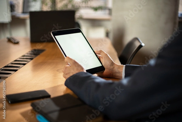 Fototapeta Close up of man using digital tablet