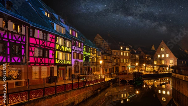 Fototapeta Colmar, Petit Venice, at dusk water canal and traditional colorful houses. Alsace, France.