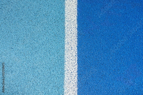 Obraz part of the athletic field with a vertical white line. top view. Texture of color rubber floor on playground