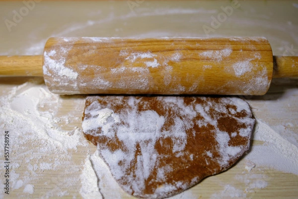 Fototapeta gingerbread dough roll on the table rolled out dough for making cookies