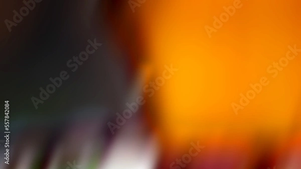 Obraz Abstract blurred background with an orange composition on the right and a dark gray color on the left.