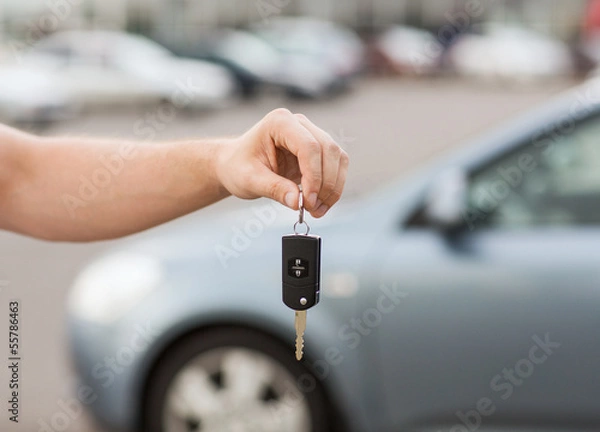 Obraz man with car key outside
