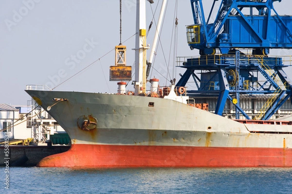 Fototapeta A ship heading to a new port