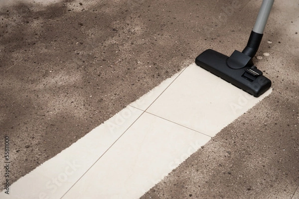Obraz Vacuum cleaning dust on a floor