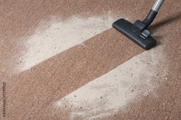 Obraz Vacuum cleaning dust on a floor