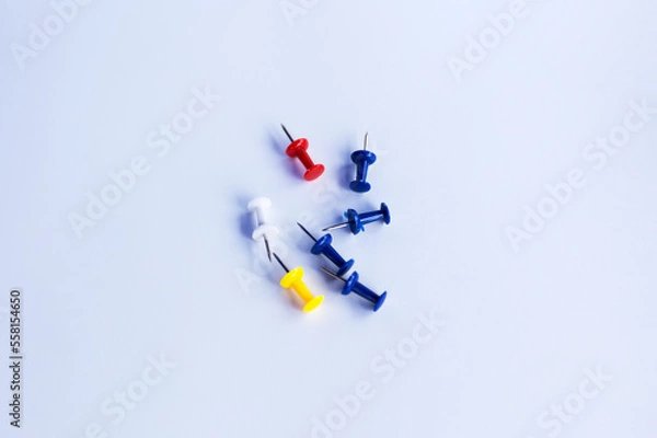 Fototapeta push pins for Notice Boards in Reusable red, blue, and yellow color isolated. white background.
