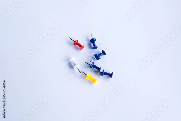 Fototapeta push pins for Notice Boards in Reusable red, blue, and yellow color isolated. white background.
