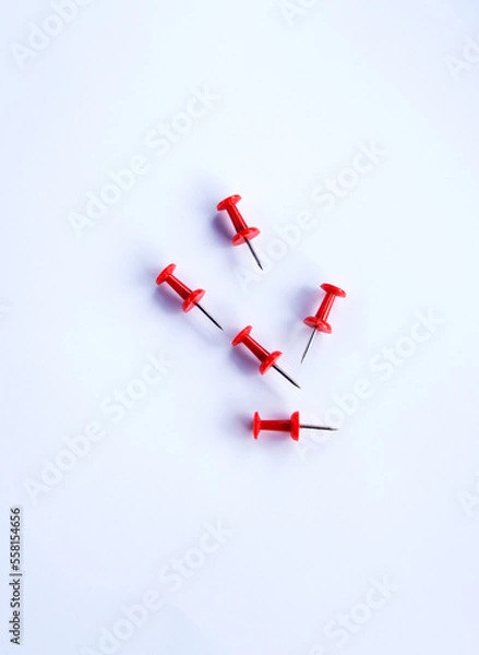Fototapeta push pins for Notice Boards in Reusable red color isolated. white background.