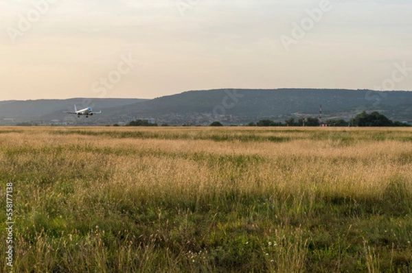 Obraz Arriving passengers at the airport through summer season.