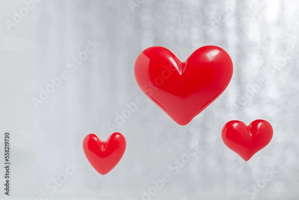 Obraz red hearts on a blurry background