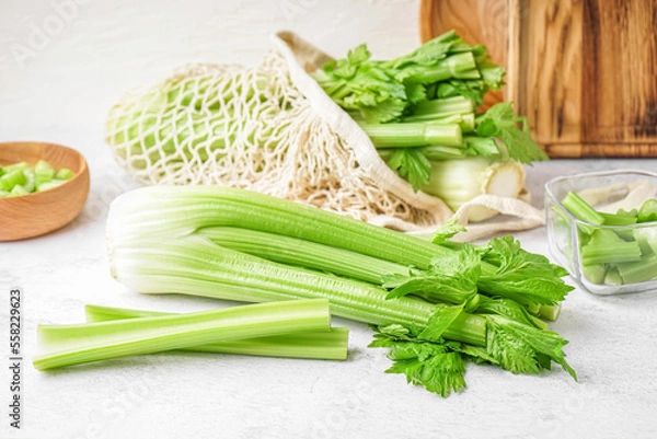 Fototapeta Fresh green celery on light table