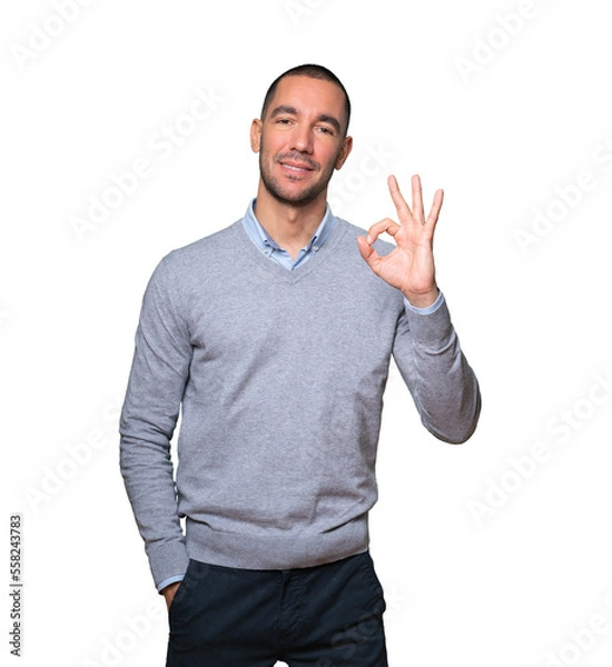 Obraz Happy young man doing an all right gesture