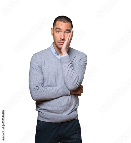 Obraz Tired young man doing a gesture of boredom