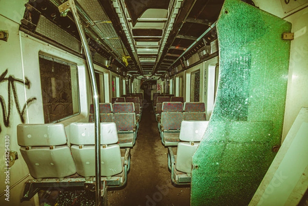 Fototapeta Old derailed train with graffitis crashed in a undergound tunnel 