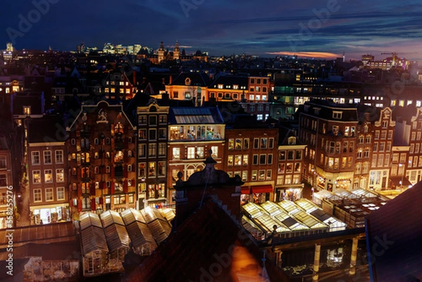 Fototapeta Aerial view of downtown Amsterdam, The Netherlands during a dramatic night evening