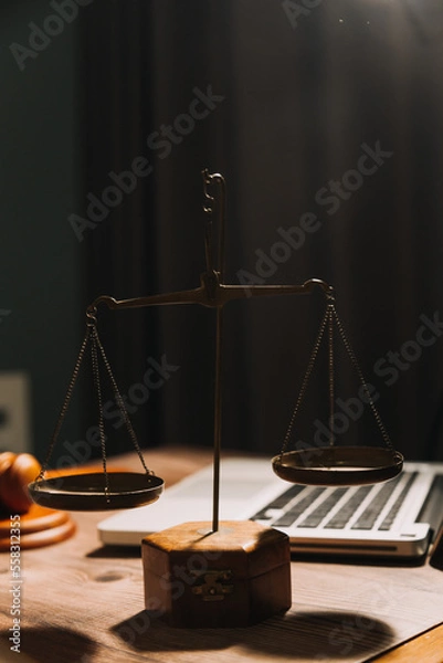 Fototapeta Business and lawyers discussing contract papers with brass scale on desk in office. Law, legal services, advice, justice and law concept picture with film grain effect