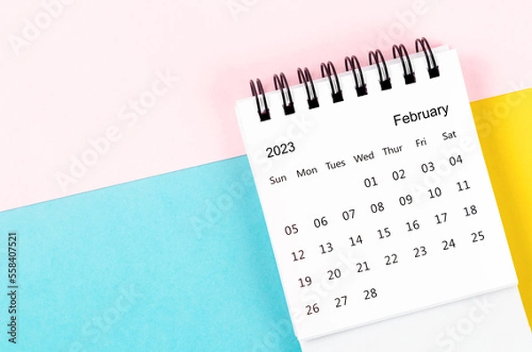 Fototapeta The February 2023 Monthly desk calendar for 2023 year on beautiful background.