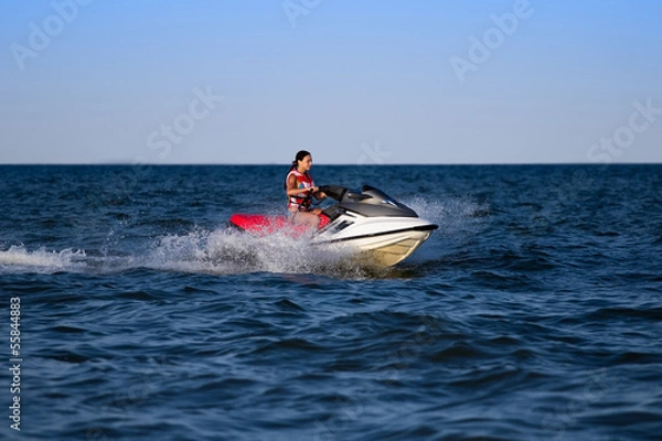 Obraz Brunette on a jetski