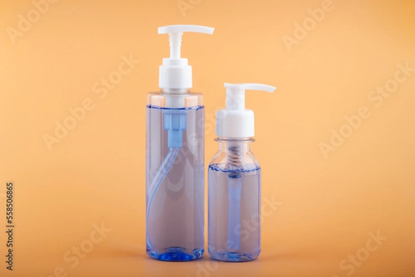 Obraz Sanitizers on a bright orange background.