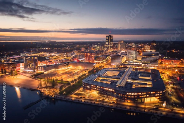 Obraz Almere city center illuminated at dusk. Suburban city near Amsterdam, The Netherlands. Aerial view.