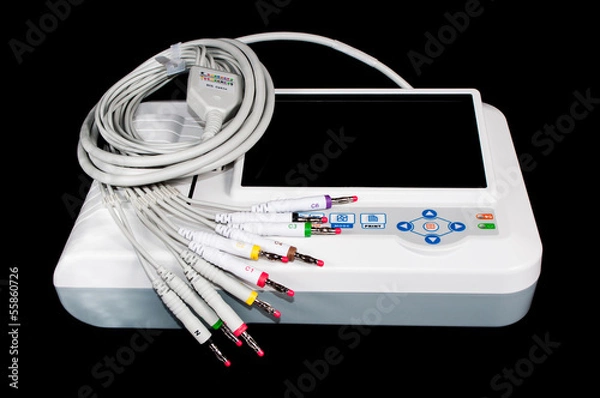 Fototapeta ECG machine isolated on black.