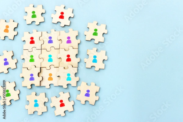 Fototapeta Business image of wooden puzzle with people icons over blue background, human resources and management concept