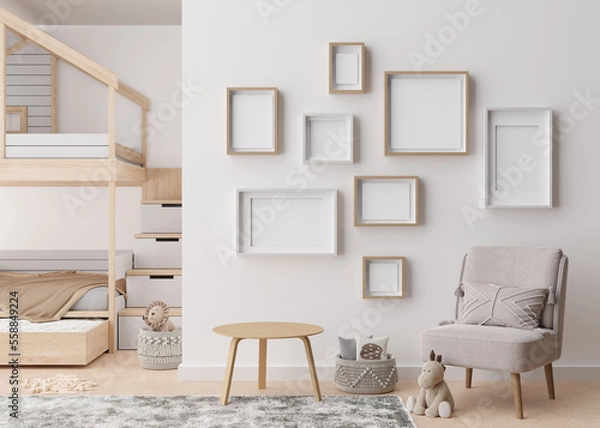 Fototapeta Various empty picture frames on white wall in modern child's room. Mock up interior in contemporary, scandinavian style. Free, copy space for picture. Group of frames. Cozy room for kids. 3D render.