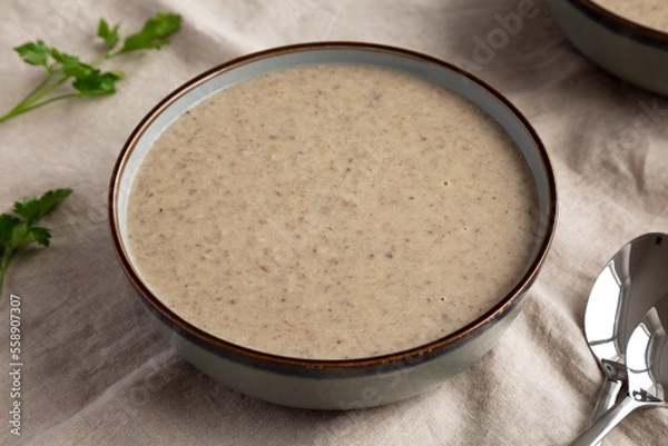 Fototapeta Homemade Cream of Mushroom Soup in a Bowl, side view.