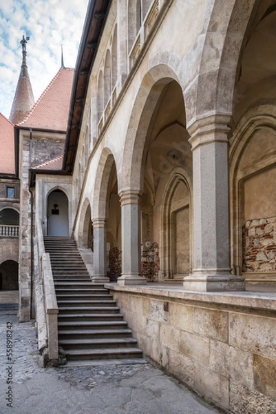 Fototapeta HUNEDOARA, ROMANIA - AUGUST 20, 2022: View with the inner courtyard of the Hunedoara Castle, also known as Corvin Castle in Hunedoara, Romania