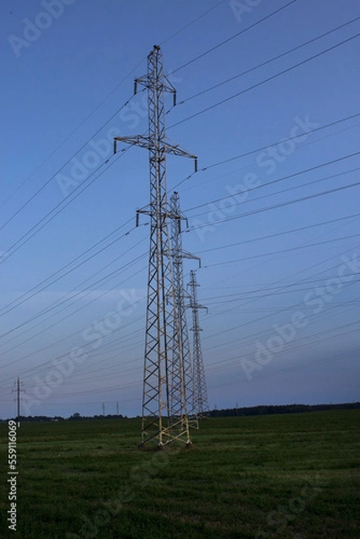 Fototapeta Power line towers against the sky. Towers of high voltage power lines.