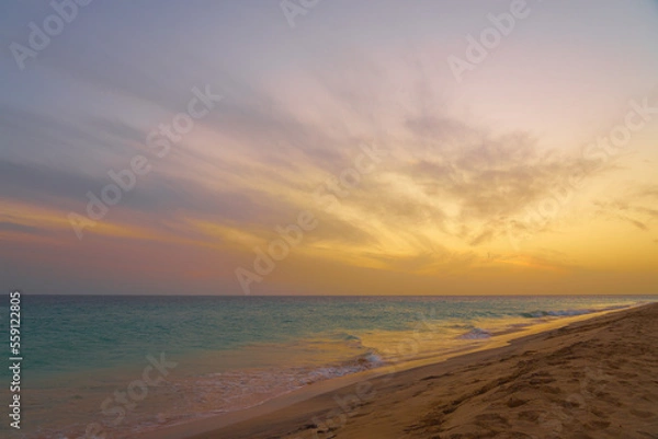 Fototapeta A colorful sunset on the Atlantic coast on the island of Sal in Cape Verde.