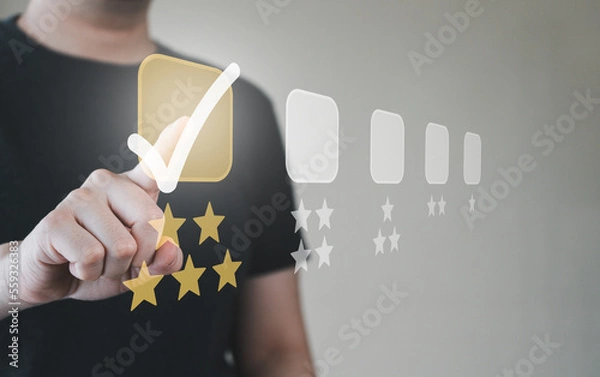 Fototapeta Man pressing five stars best rating button on virtual touch screen. Customer service satisfaction evaluation concept.
