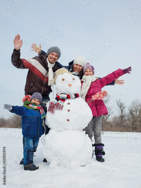 Fototapeta Family with a snowman