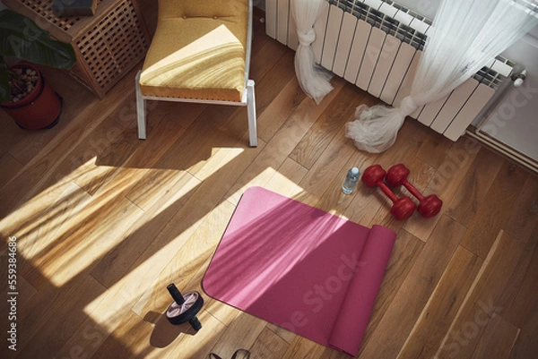 Obraz Training inside the living room, exercising at home.