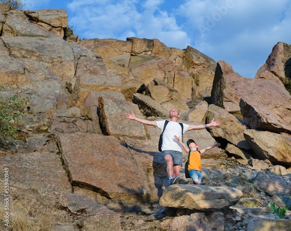 Obraz Father and son on a mountain ledge