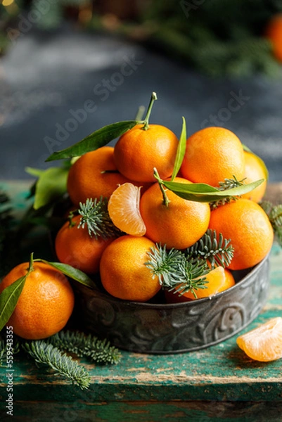 Obraz Christmas tangerines in metal box with christmas decorations on dark background. Christmas concept 