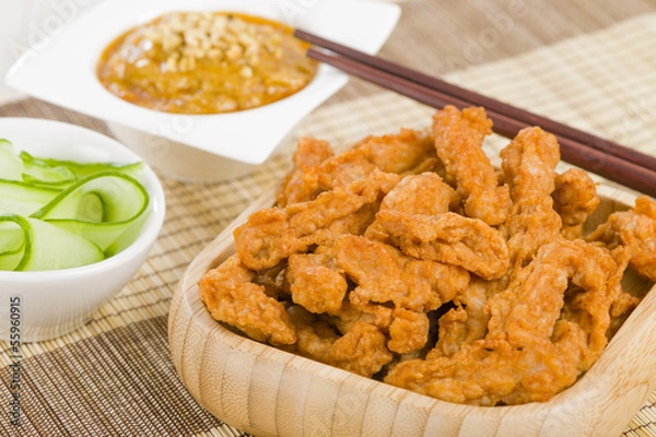 Fototapeta Malaysian style spicy chicken, peanut sauce and cucumber.