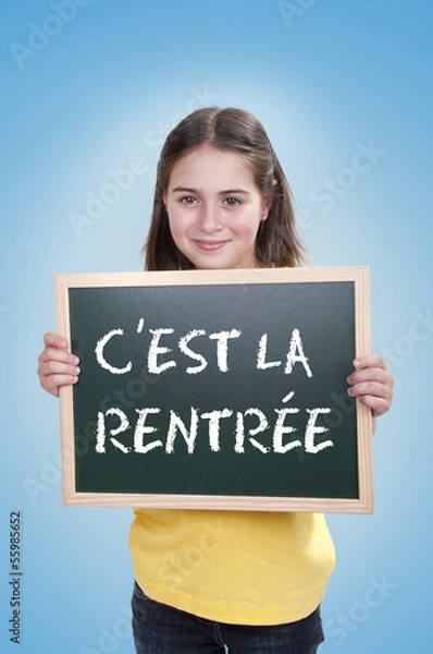 Fototapeta Happy school girl with chalk board