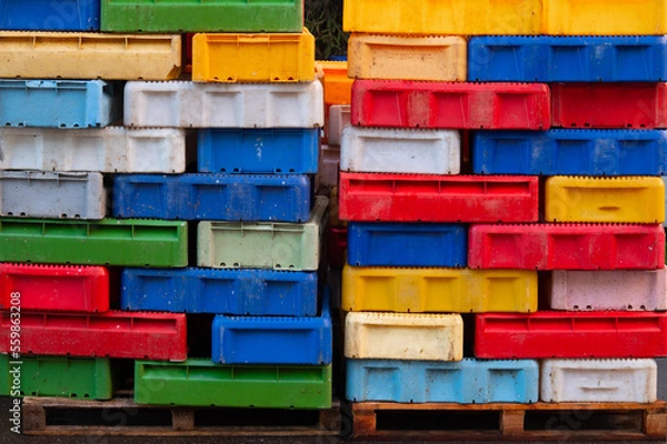 Obraz Colored fish boxes. Stacked fishing containers.