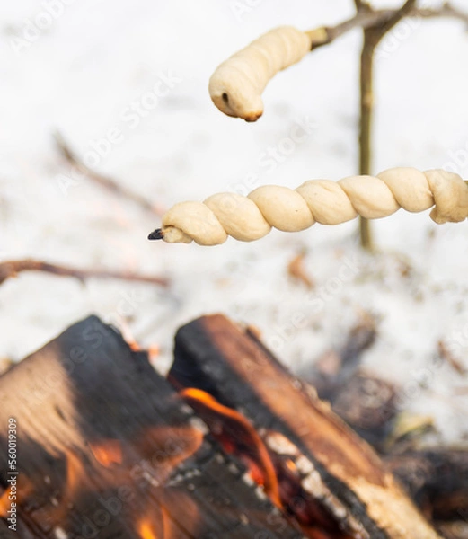 Obraz Stick bread roasting over a fire 