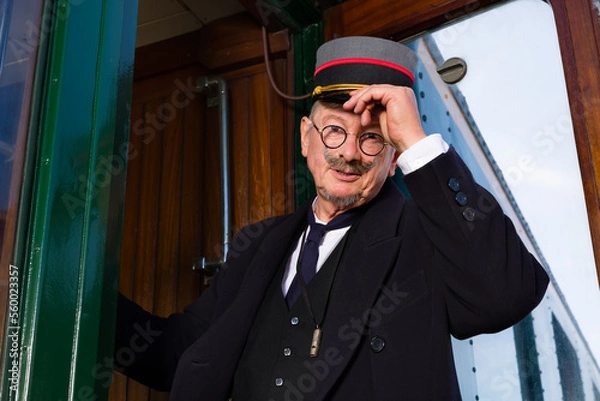 Fototapeta Retro train conductor saying goodbye