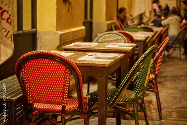 Fototapeta Tables on a restaurant terrace in Malaga, Spain