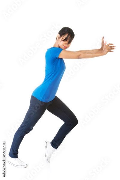 Obraz Woman pushing something imaginary