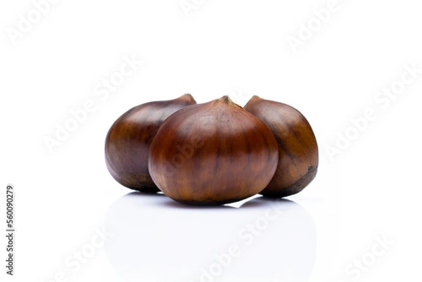 Obraz Raw roasted chestnuts on white background	
