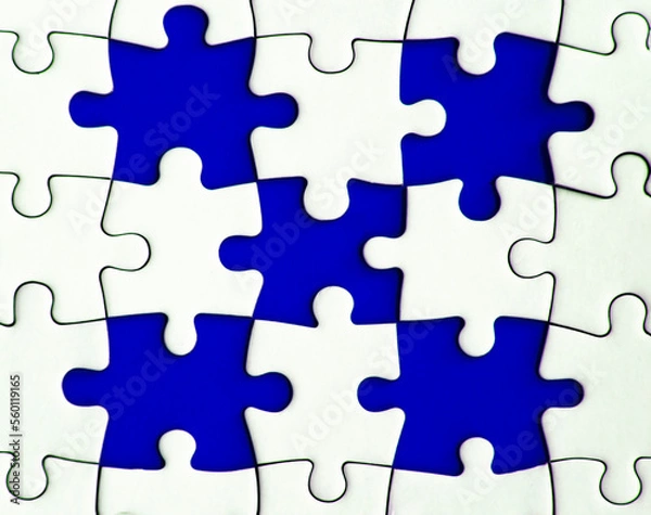 Fototapeta Missing jigsaw puzzle on blue background with customizable space for text or ideas. Copy space