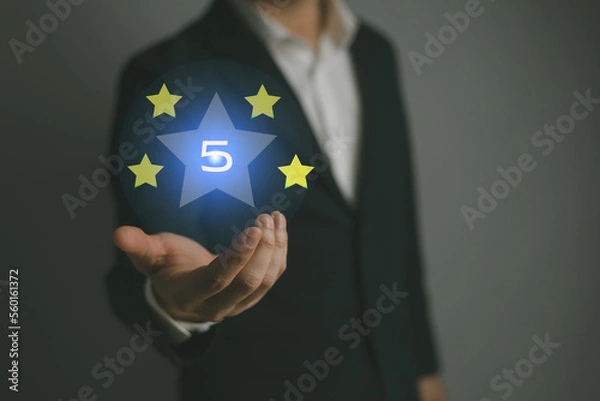 Obraz businessman are rating the highest 5 stars satisfaction from customers who use appraisal services through online applications. business, online application, service concept..