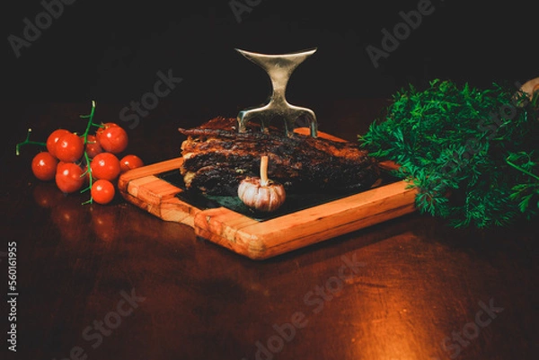 Fototapeta Get ready for a sizzling summer with this mouthwatering barbecue feast! Our juicy meats are cooked to perfection over an open flame, infusing them with smoky flavor that will leave your taste buds wan